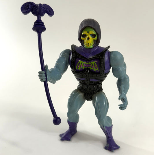 Mattel 1983 Battle Armor Skeletor with good condition legs, standing with Havoc staff. 