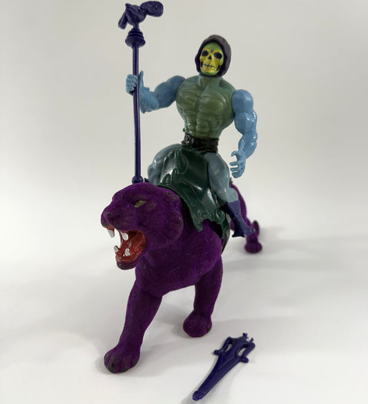 Skeletor 1980s action figure with staff and blade weapons, on Panthor, with saddle and belt. 